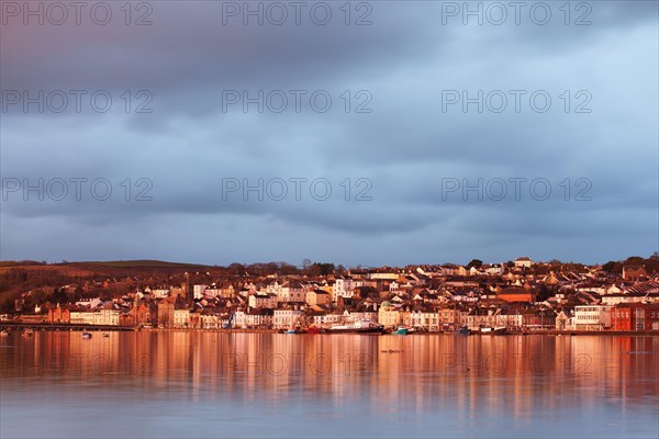 View across the estuary at high tide towards the town