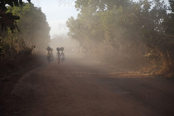 Women carrying goods for the market on their heads