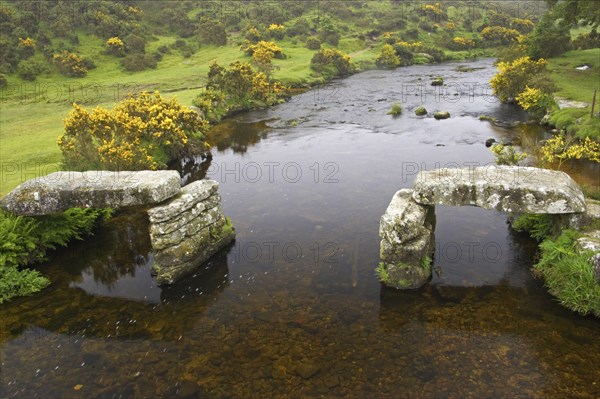 Ruined rattle bridge over the river