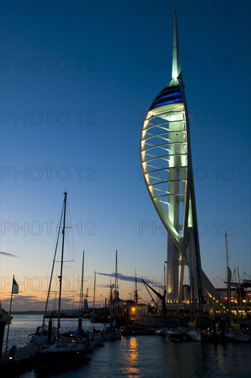 View of harbour and waterfront with Spinnaker Tower illuminated after sunset