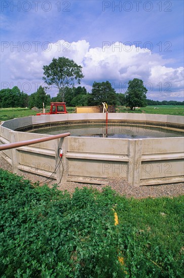 Concrete-sided slurry lagoon on the farm