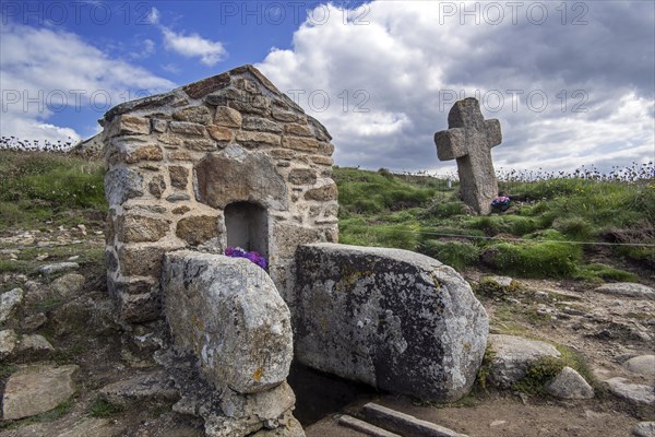 Saint well and stone cross at Saint Samson Chapel