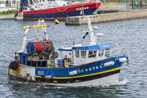 Trawler fishing boat leaving the port of Guilvinec