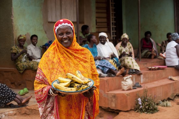 Smiling Muslim lady with light headscarf