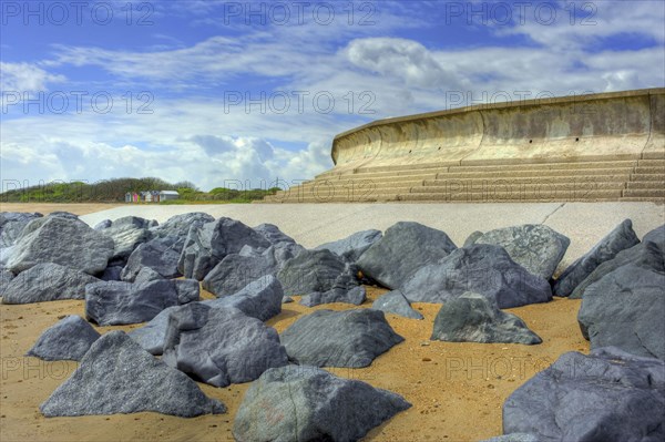 Sea defences and beach huts by the sea