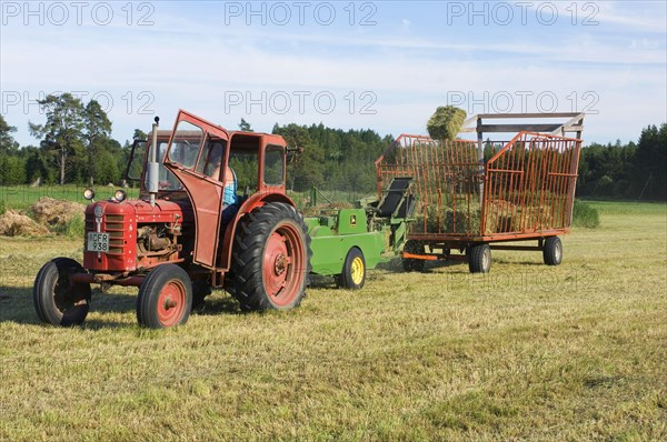 Tractor baling hay