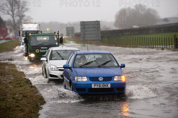 Flooded road with traffic