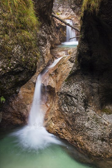 Waterfall in the Almbach river flowing through the Almbachklamm gorge in the Berchtesgaden Alps