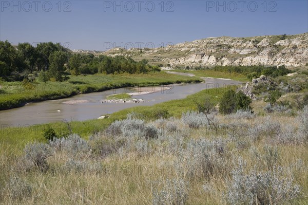 View of river flowing through ranch country