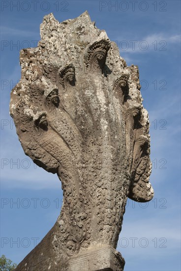 Seven-headed Naga sculpture at the end of the passage in the Khmer temple