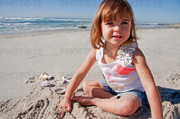 Baby girl playing in the sand at Marine Street Beach