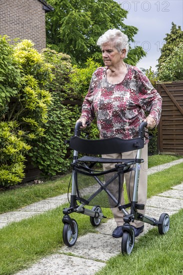 Elderly woman with rollator