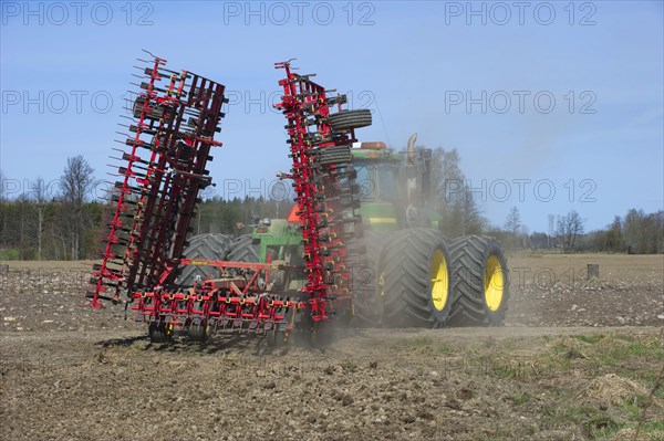 John Deere 9400 Tractor with Harrows