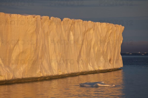 Coastal glacier terminus at sunset