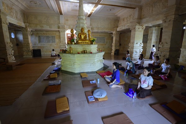 Believers meditate in prayer room