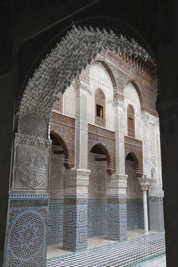 Madrasah courtyard with archway in city