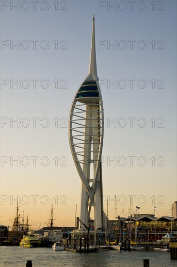 View of harbour and waterfront with Spinnaker Tower in evening light