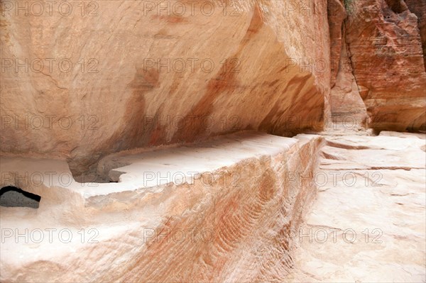 Restored ancient water conduit in Siq