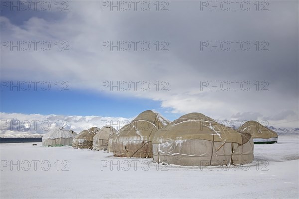 Yurts in a traditional Kyrgyz yurt camp in the snow at Song Kul