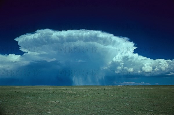 Hail storm anvil cloud tracking northeast across high plains