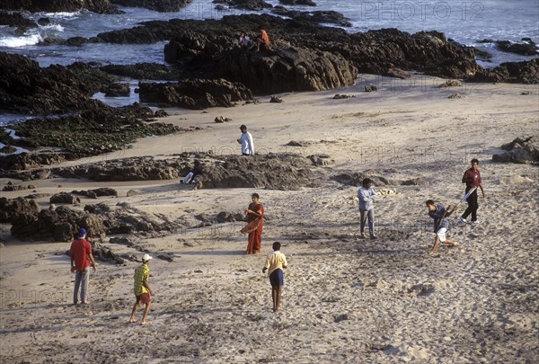 People playing in Tenneti beach in Visakhapatnam or Vizag