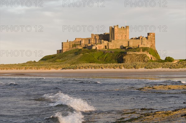 View across beach and sea towards castle