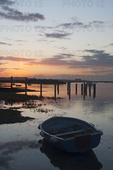 View of boats in coastal stream at high tide