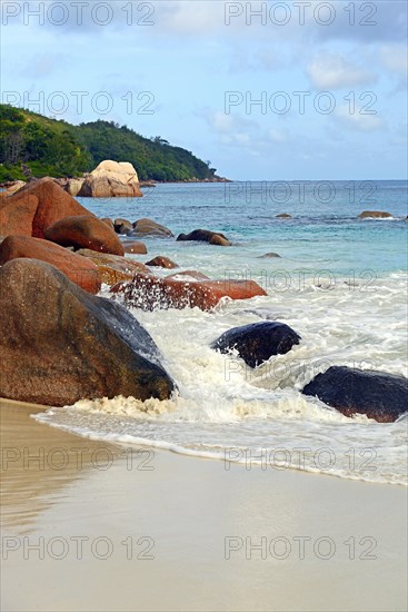 Beach and rocks of Anse Lazio in the evening