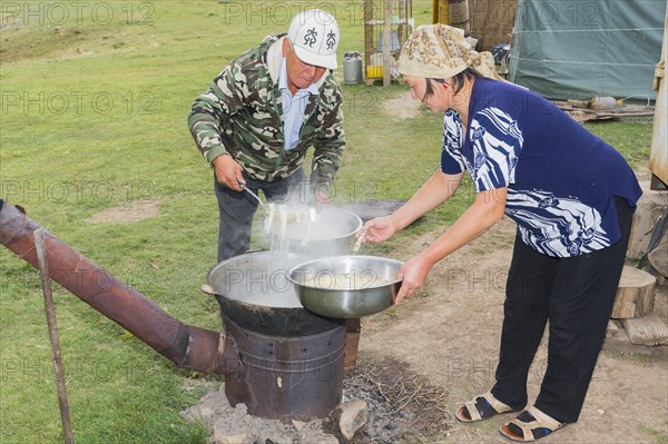 Kazakh nomads preparing noodles