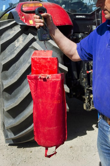 Farmer checking how much to sow on the Vaderstad Rapid A 600S seed drill