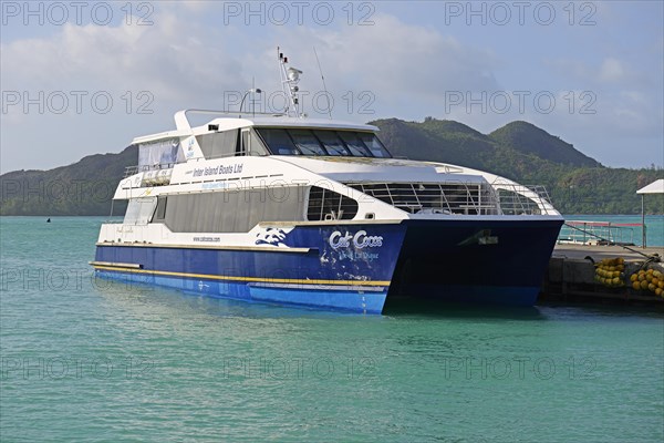 Catamaran ferry of the operator Cat Cocos in the harbour of Praslin Island