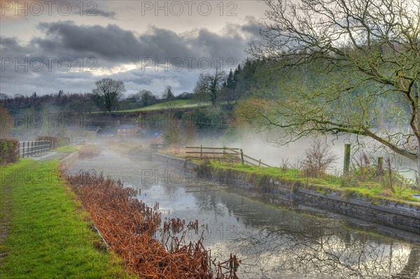 View of mist over the canal aquaduct at dusk