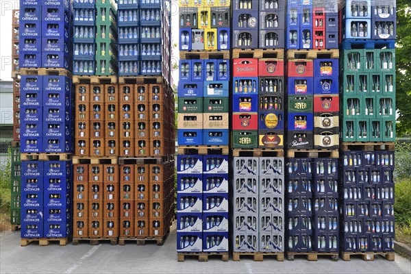 Pallets with empties in the yard of a beverage market