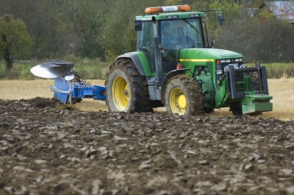 John Deere 8400 tractor with eight-furrow reversible plough