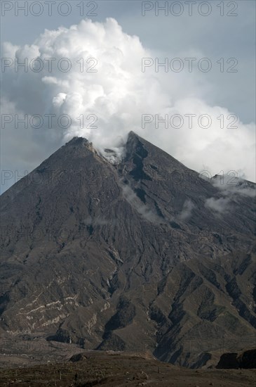 Recently erupted volcano with ash clouds