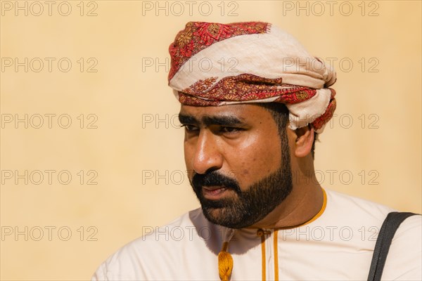 Man performing traditional songs during the Friday Goat Market in Nizwa