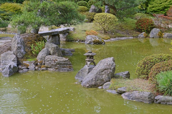 Typical Japanese garden with stone decorations