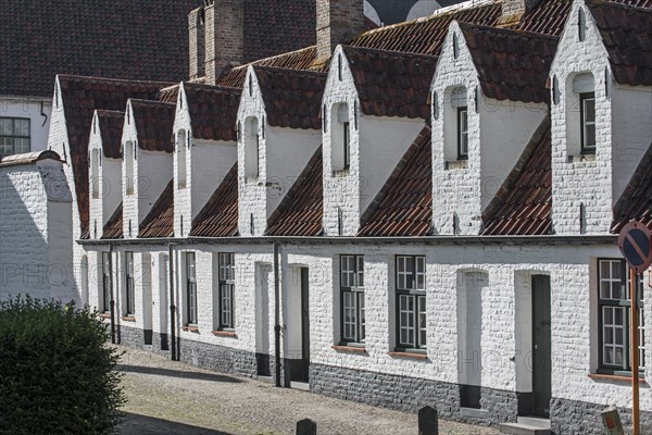 Alley with medieval almshouses in Bruges