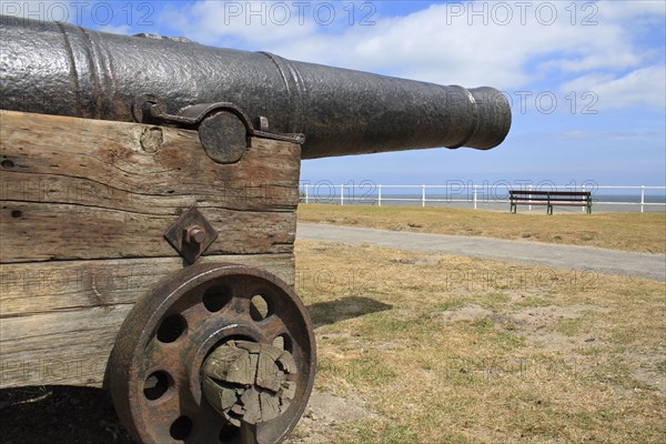 18th Century 18-pounder gun on seafront of seaside town