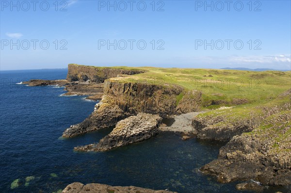 View of coastline with cliffs and columnar basalt rocks