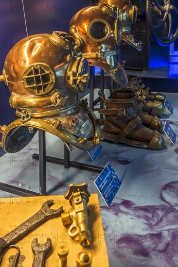 Copper diving helmets and weighted shoes at the Cite de la Mer