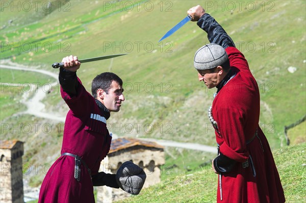 Dagger fighting demonstration by two Georgian men of a folklore group