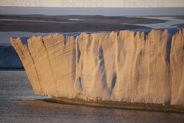 View of the end of the coastal glacier at sunset