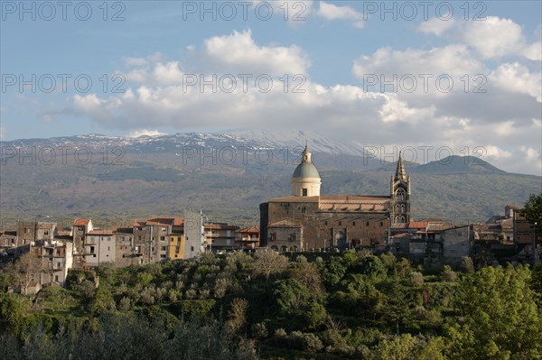 View of a village with volcano in the background