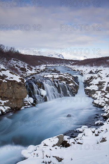 Hlauptungufoss waterfall on the Bruara River in winter