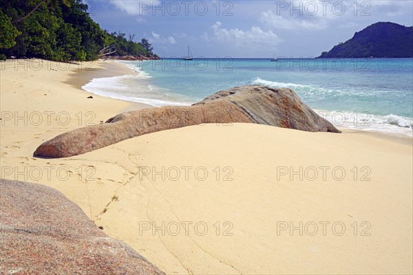 Beach and granite rocks at Anse Boudin