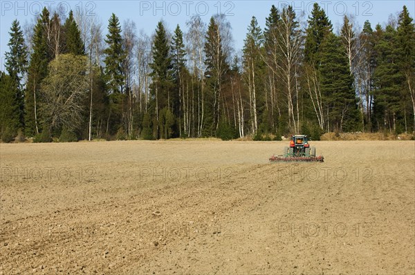 Harrow pulling tractor