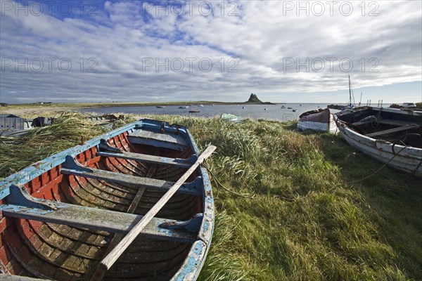 View of boats and coastline with castle in the distance