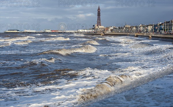 Stormy sea at high tide in seaside resort