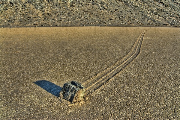 'Sailing stones' geological phenomenon of rocks moving along tracks on valley floor